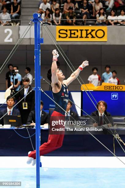 Kohei Uchimura falls while competing in the Men's Horizontal Bar on day one of the 72nd All Japan Artistic Gymnastics Apparatus Championships at...