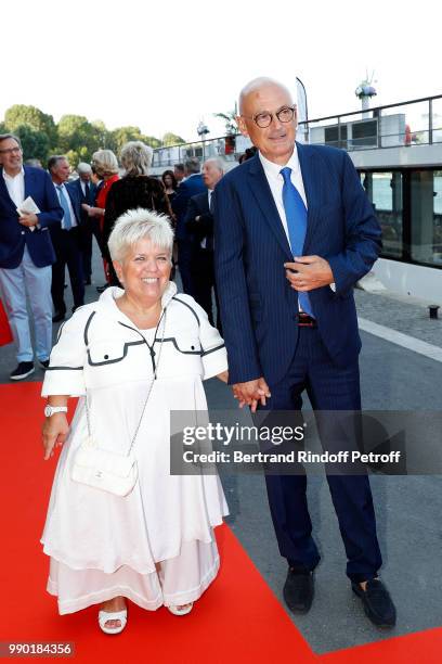 Mimie Mathy and her husband Benoist Gerard attends "Line Renaud's 90th Anniversary" on July 2, 2018 in Paris, France.