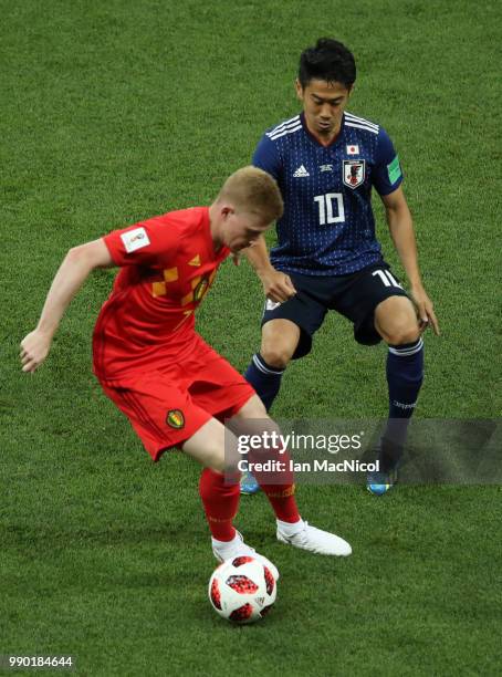 Kevin De Bruyne of Belgium vies with Shinji Kagawa of Japan during the 2018 FIFA World Cup Russia Round of 16 match between Belgium and Japan at...