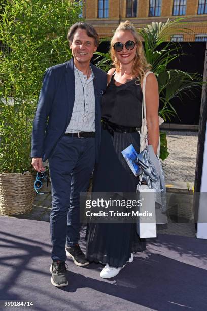 Wolfgang Bahro and Eva Mona Rodekirchen attend the Guido Maria Kretschmer show during the Berlin Fashion Week Spring/Summer 2019 at ewerk on July 2,...