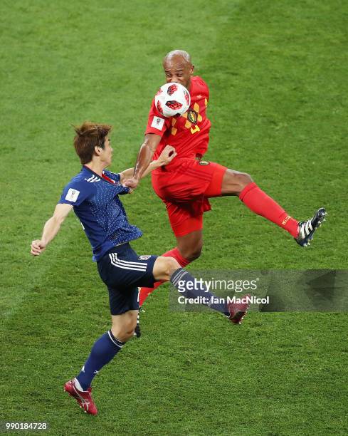 Yuya Osako of Japan challenges Vincent Kompany of Belgium during the 2018 FIFA World Cup Russia Round of 16 match between Belgium and Japan at Rostov...