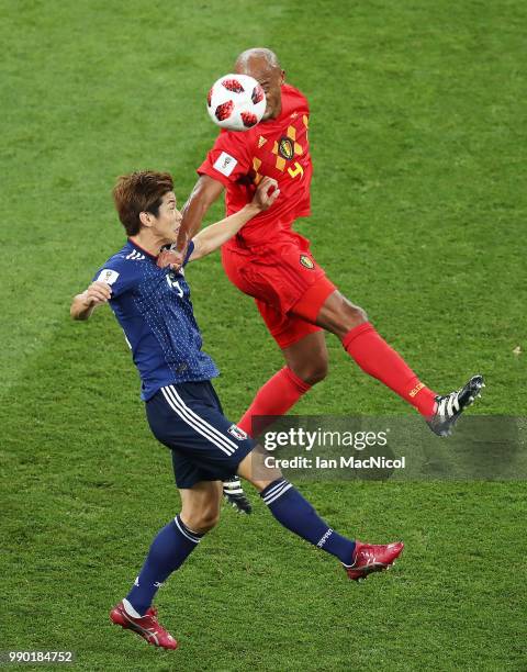 Yuya Osako of Japan challenges Vincent Kompany of Belgium during the 2018 FIFA World Cup Russia Round of 16 match between Belgium and Japan at Rostov...