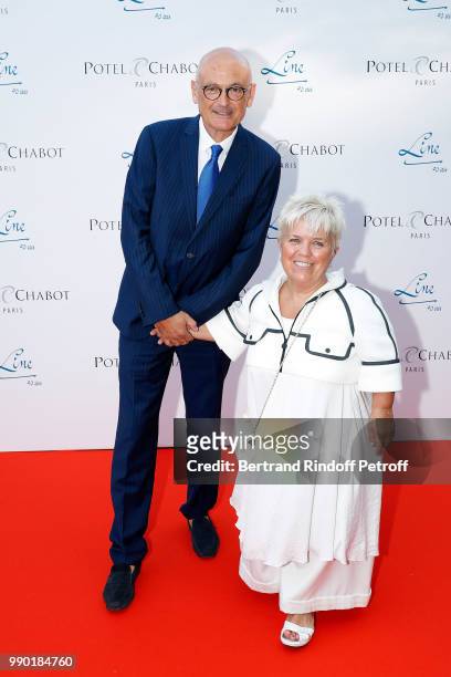 Mimie Mathy and her husband Benoist Gerard attends "Line Renaud's 90th Anniversary" on July 2, 2018 in Paris, France.