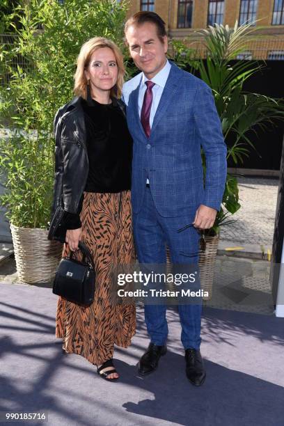 Anja Tillack and US actor Vincent de Paul attend the Guido Maria Kretschmer show during the Berlin Fashion Week Spring/Summer 2019 at ewerk on July...