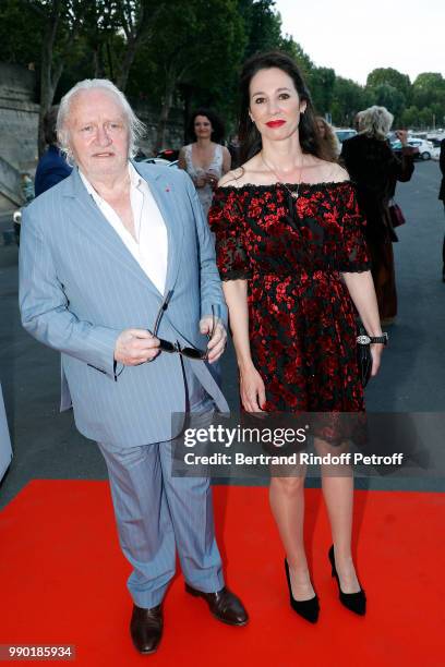 Niels Arestrup and Isabelle Le Nouvel attend Line Renaud's 90th Anniversary on July 2, 2018 in Paris, France.