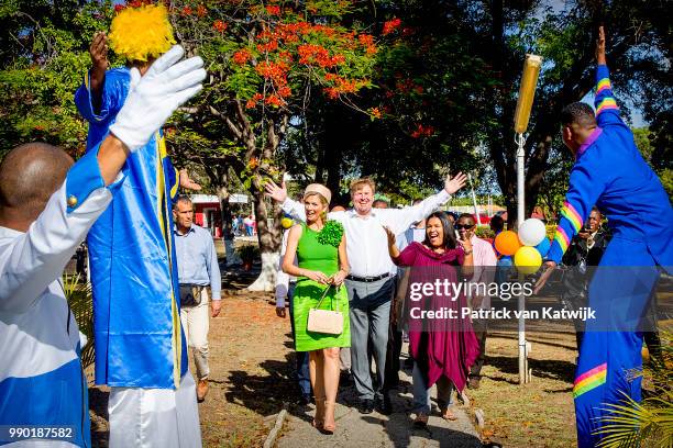 King Willem-Alexander of The Netherlands and Queen Maxima of The Netherlands visits Excel Arts Academy during the Dia di Bandera celebrations on July...