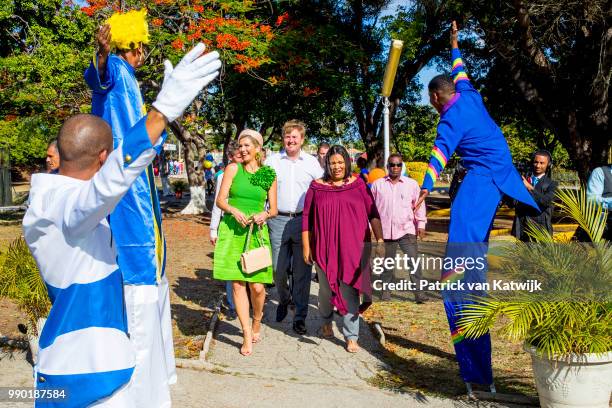 King Willem-Alexander of The Netherlands and Queen Maxima of The Netherlands visits Excel Arts Academy during the Dia di Bandera celebrations on July...