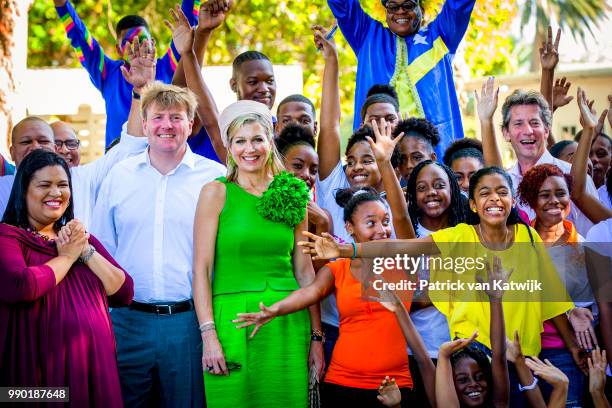 King Willem-Alexander of The Netherlands and Queen Maxima of The Netherlands visits Excel Arts Academy during the Dia di Bandera celebrations on July...