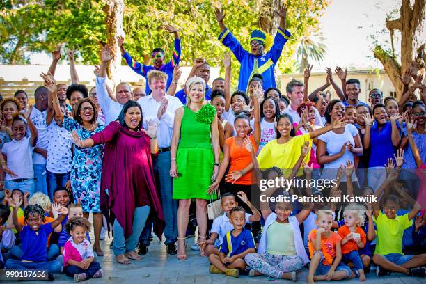 King Willem-Alexander of The Netherlands and Queen Maxima of The Netherlands visits Excel Arts Academy during the Dia di Bandera celebrations on July...