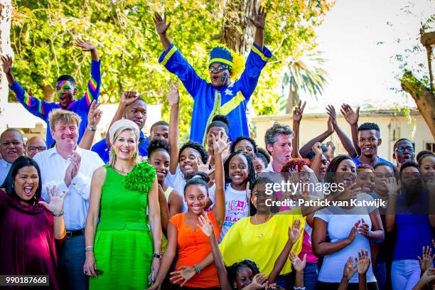 King Willem-Alexander of The Netherlands and Queen Maxima of The Netherlands visits Excel Arts Academy during the Dia di Bandera celebrations on July...