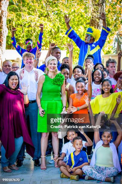 King Willem-Alexander of The Netherlands and Queen Maxima of The Netherlands visits Excel Arts Academy during the Dia di Bandera celebrations on July...