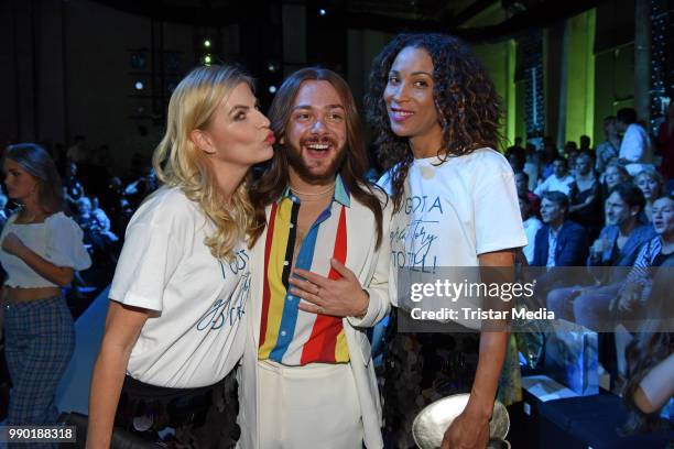 Tanja Buelter, Riccardo Simonetti and Annabelle Mandeng attend the Guido Maria Kretschmer show during the Berlin Fashion Week Spring/Summer 2019 at...