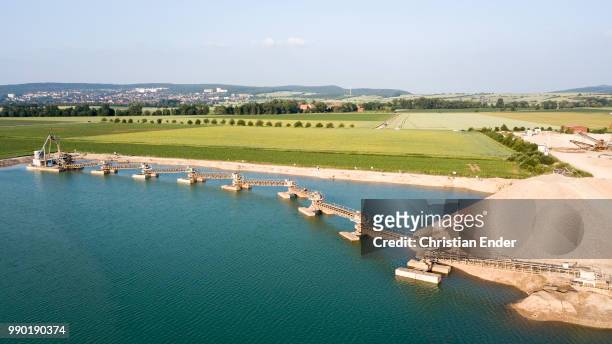aerial view of a lake  and conveyor belts at göttingen in germany - göttingen stock-fotos und bilder
