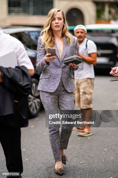 Melissa George wears a blazer jacket , outside Schiaparelli, during Paris Fashion Week Haute Couture Fall Winter 2018/2019, on July 2, 2018 in Paris,...