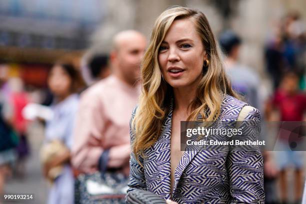 Melissa George wears a blazer jacket , outside Schiaparelli, during Paris Fashion Week Haute Couture Fall Winter 2018/2019, on July 2, 2018 in Paris,...