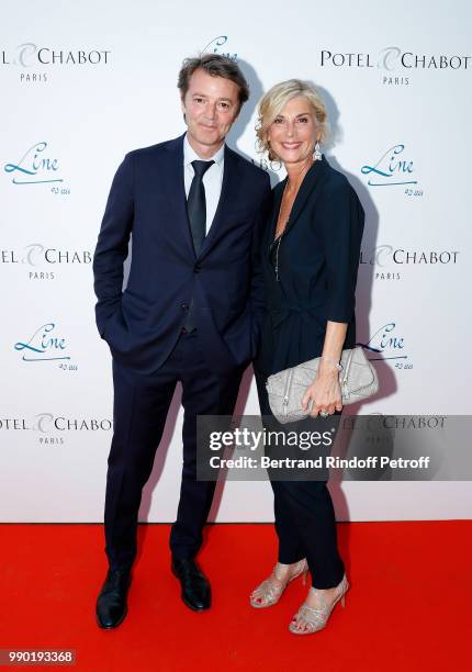 Francois Baroin and Michele Laroque attend Line Renaud's 90th Anniversary on July 2, 2018 in Paris, France.