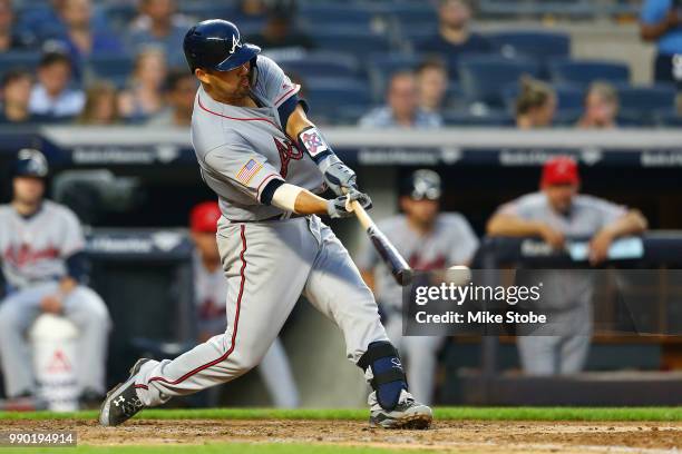 Kurt Suzuki of the Atlanta Braves hits an RBI double in the top of the fourth inning against the New York Yankees at Yankee Stadium on July 2, 2018...