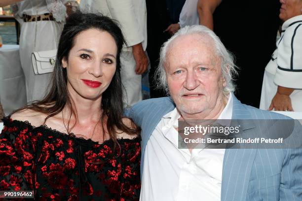 Niels Arestrup and Isabelle Le Nouvel attend Line Renaud's 90th Anniversary on July 2, 2018 in Paris, France.