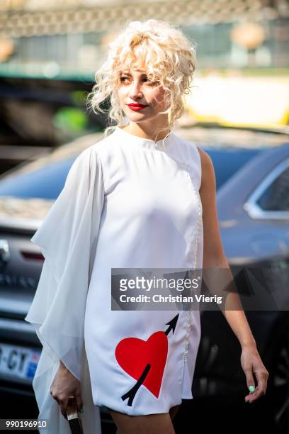 Pixie Lott wearing white dress is seen outside Schiaparelli on day two during Paris Fashion Week Haute Couture FW18 on July 2, 2018 in Paris, France.