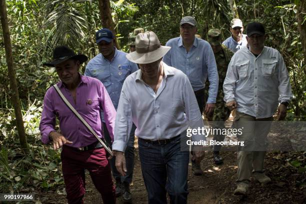 Juan Manuel Santos, Colombia's president, center, tours the Chiribiquete National Park near San Jose del Guaviare, Colombia, on Monday, July 2, 2018....