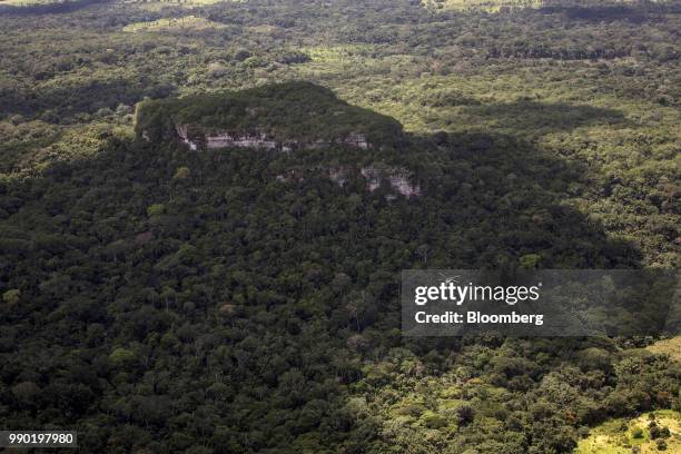 Helicopter flies above Chiribiquete National Park in this aerial photograph taken above San Jose del Guaviare, Colombia, on Monday, July 2, 2018. The...