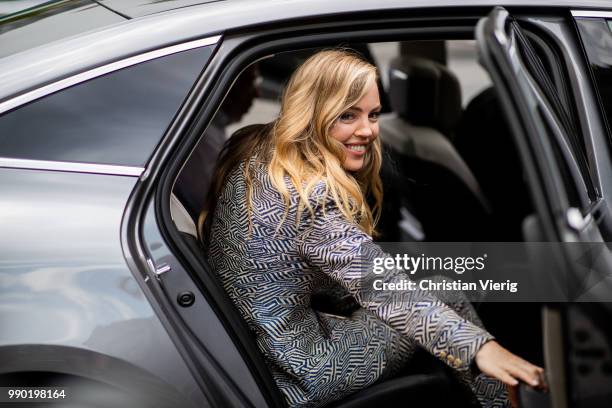 Melissa George is seen outside Schiaparelli on day two during Paris Fashion Week Haute Couture FW18 on July 2, 2018 in Paris, France.