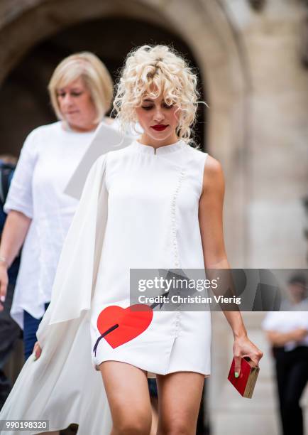 Pixie Lott wearing white dress is seen outside Schiaparelli on day two during Paris Fashion Week Haute Couture FW18 on July 2, 2018 in Paris, France.