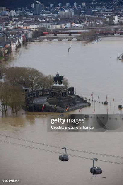 The "Deutsches Eck" headland with the equestrian statue of Kaiser Wilhelm at the convergence of the rivers Rhine and Mosel is surrounded by flood...