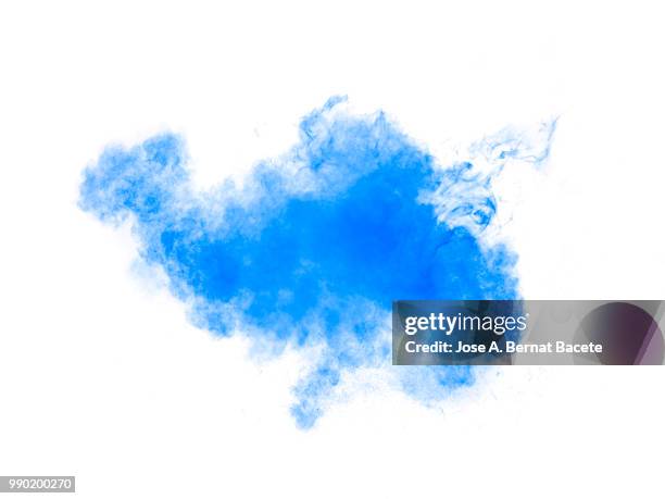 full frame of forms and textures of an explosion of powder and smoke of color light blue and dark blue on a white background. - blue smoke stockfoto's en -beelden