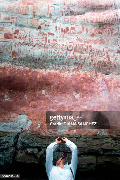 Journalist at the Cerro Azul, in Serrania La Lindosa -which had been declared Protected Archaeological Site of Colombia last May- in the Amazonian...
