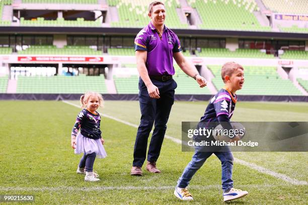 Melbourne Storm veteran Ryan Hoffman plays with his children Mia and Zach during a press conference to announcement his retirement on July 3, 2018 in...