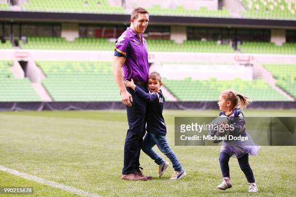 Melbourne Storm veteran Ryan Hoffman plays with his children Mia and Zach during a press conference to announcement his retirement on July 3, 2018 in...