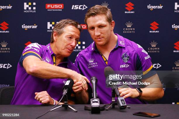 Melbourne Storm veteran Ryan Hoffman and head coach Craig Bellamy shake hands during a press conference to announce his retirement on July 3, 2018 in...