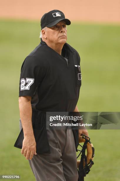 Umpire Larry Vanover looks on during a baseball game between the Washington Nationals and the Philadelphia Phillies at Nationals Park on June 23,...