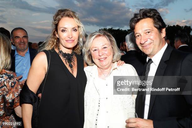 Christelle Bardet, Maryvonne Pinault and Laurent Gerra attend Line Renaud's 90th Anniversary on July 2, 2018 in Paris, France.