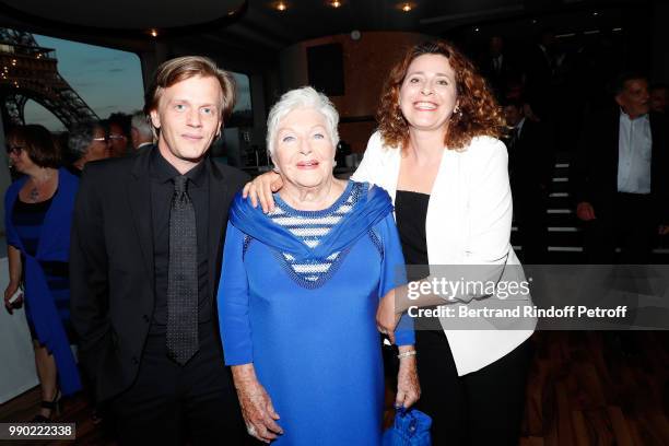 Alex Lutz and his wife Mathilde Vial with Line Renaud attend Line Renaud's 90th Anniversary on July 2, 2018 in Paris, France.