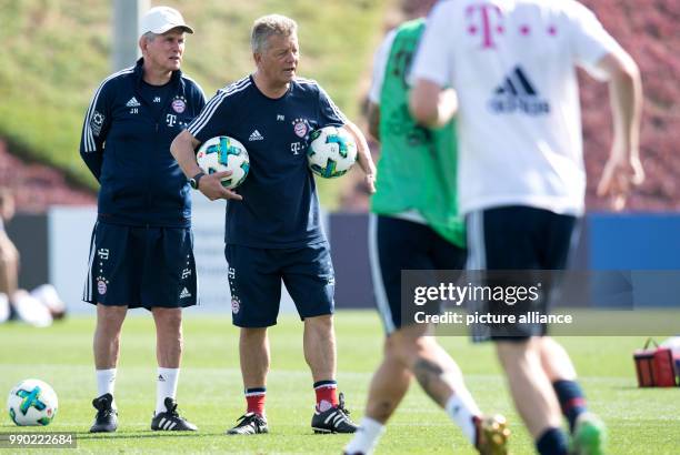 Bayern Munich's head coach Jupp Heynckes and co-coach Peter Herrmann participate in the training session in Doha, Qatar, 07 January 2017. The...