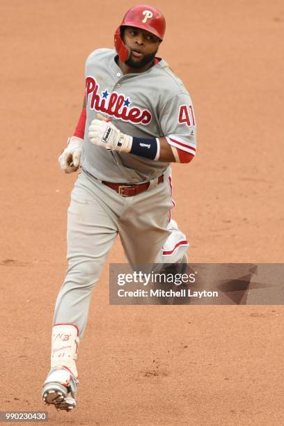 Carlos Santana of the Philadelphia Phillies rounds the bases after hitting a home run during a baseball game against the Washington Nationals at...