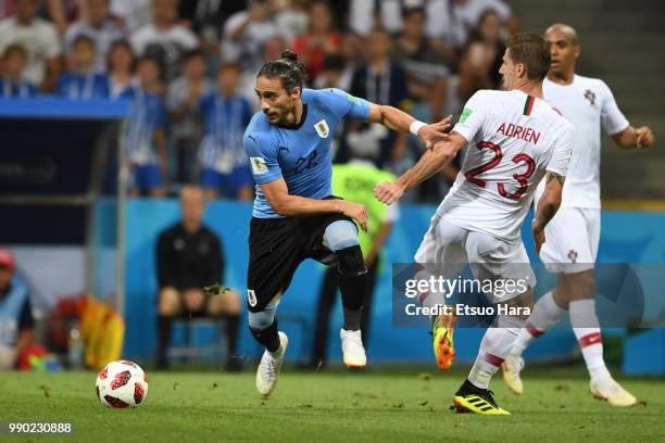 Martin Caceres of Uruguay and Adrien Silva of Portugal compete for the ball during the 2018 FIFA World Cup Russia Round of 16 match between Uruguay...