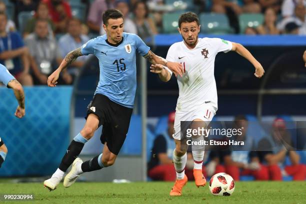 Matias Vecino of Uruguay and Bernardo Silva of Portugal compete for the ball during the 2018 FIFA World Cup Russia Round of 16 match between Uruguay...