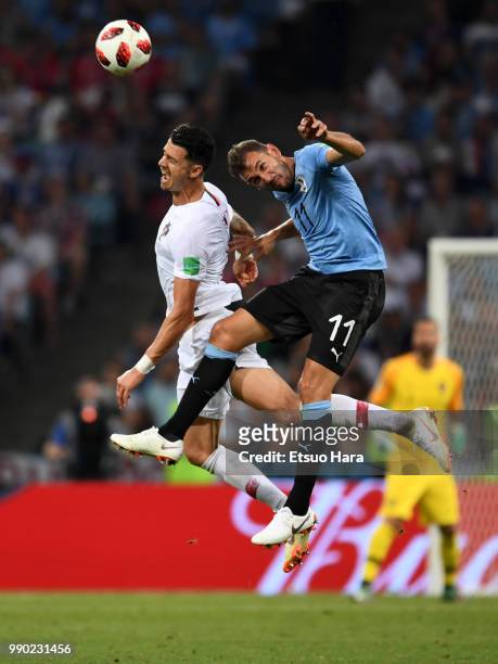Christhian Stuani of Uruguay and Jose Fonte of Portugal compete for the ball during the 2018 FIFA World Cup Russia Round of 16 match between Uruguay...