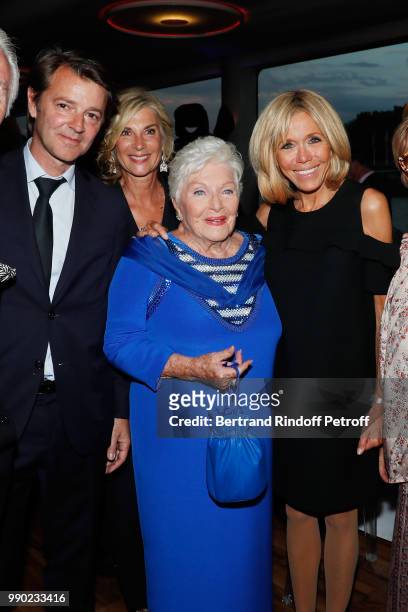 Francois Baroin, Michele Laroque, Line Renaud and Brigitte Macron attend Line Renaud's 90th Anniversary on July 2, 2018 in Paris, France.