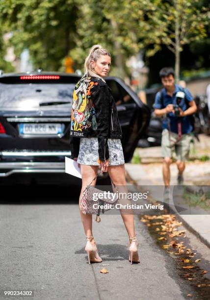Helena Bordon wearing Dior bag and bag with back print is seen outside Dior on day two during Paris Fashion Week Haute Couture FW18 on July 2, 2018...