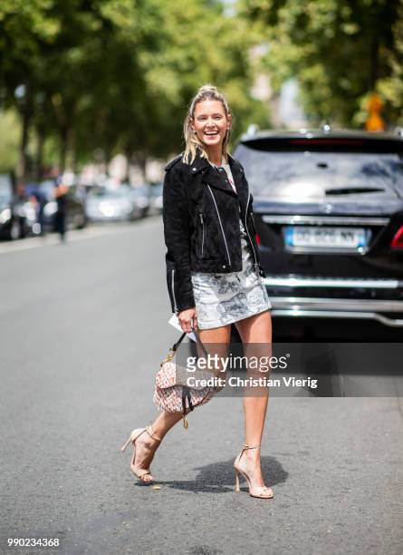 Helena Bordon wearing Dior bag and bag with back print is seen outside Dior on day two during Paris Fashion Week Haute Couture FW18 on July 2, 2018...