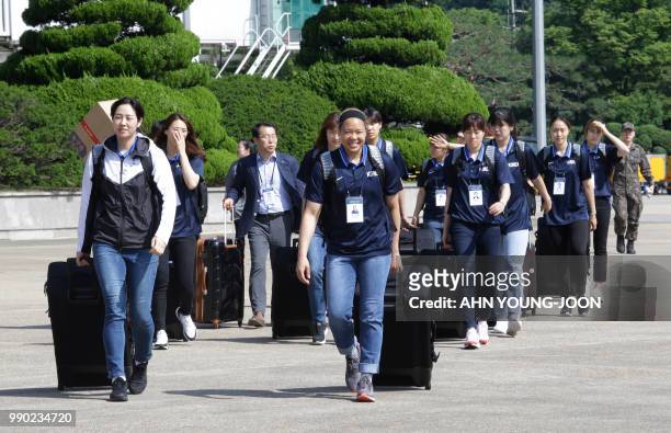 South Korean women basketball players arrive to board a plane to leave for Pyongyang, in North Korea, to participate in inter-Korean basketball...