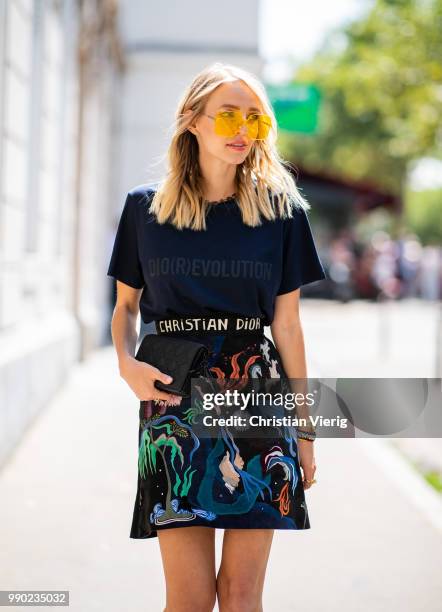 Leonie Sophie Hanne wearing Dior tshirt and printed skirt is seen outside Dior on day two during Paris Fashion Week Haute Couture FW18 on July 2,...