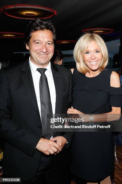 Laurent Gerra and Brigitte Macron attend Line Renaud's 90th Anniversary on July 2, 2018 in Paris, France.