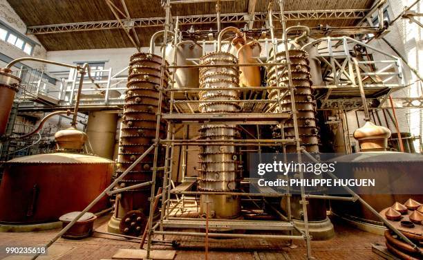 Picture shows alembics and colums of distillation at the Claeyssens de Wambrechies ditellery on June 28, 2018 in Wambrechies. - Classified as...