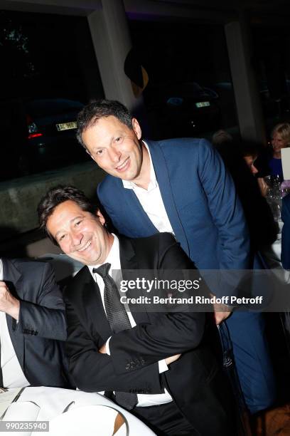 Laurent Gerra and Marc Olivier Fogiel attend Line Renaud's 90th Anniversary on July 2, 2018 in Paris, France.