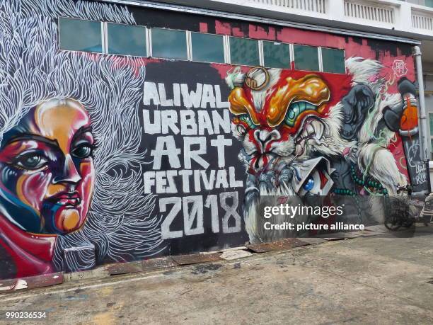 Graffiti advertises for a festival for urban art in Singapore, Singapore, 28 December 2018. While illegal graffiti sprayings are regarded as petty...